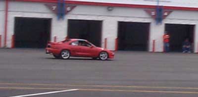 Steve Massaro's 550 HP "Monster" at speed around the Winston Cup Garages